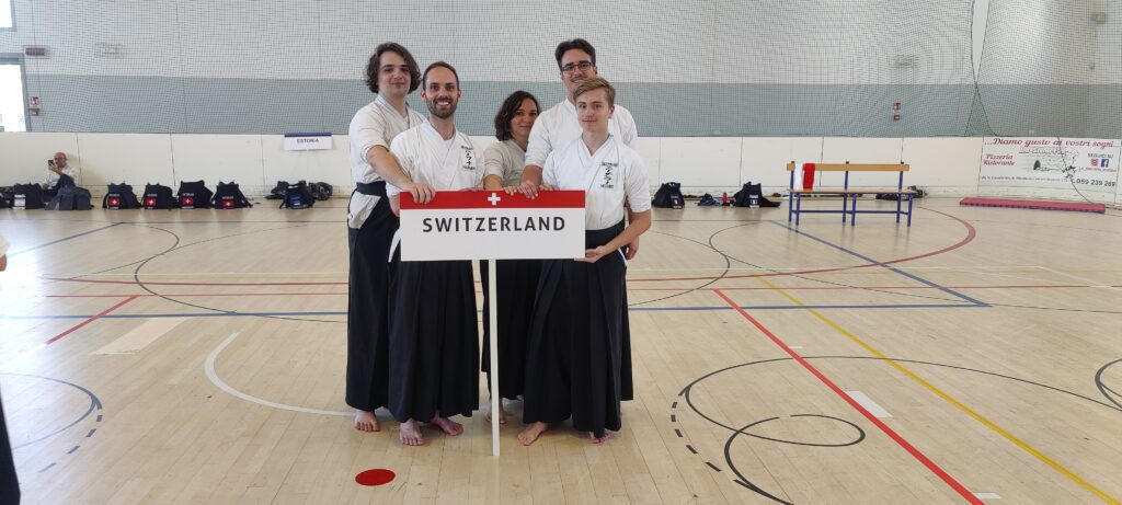 Swiss Team in front of a Switzerland sign